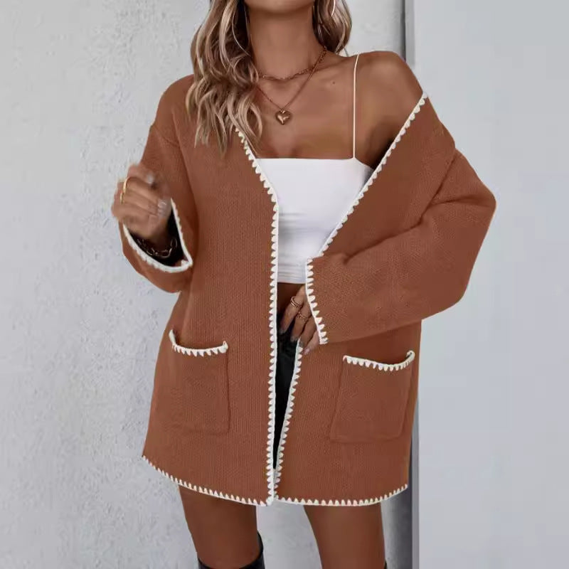 Stilig og komfortabel oversized strikket cardigan til dame, ideell for lagpålag og hverdagslig bruk.