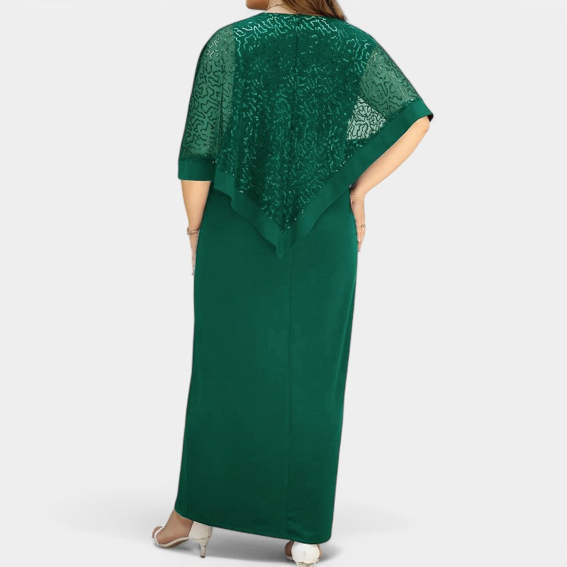 Moteriktig kvinnekjole med skinnende paljetter og batwing-ermer; en glamorøs tunikakjole for fest og stil.