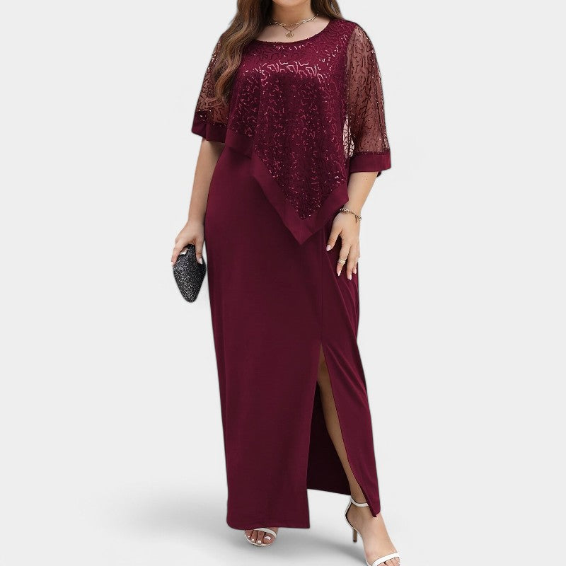 Elegant kvinnekjole med løs passform, glitrende paljetter og unike batwing-ermer for en chic festlook.