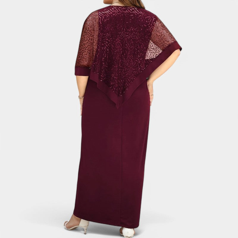 Moteriktig tunikakjole for dame, med komfortable batwing-ermer og skinnende paljetter for glamorøse anledninger.