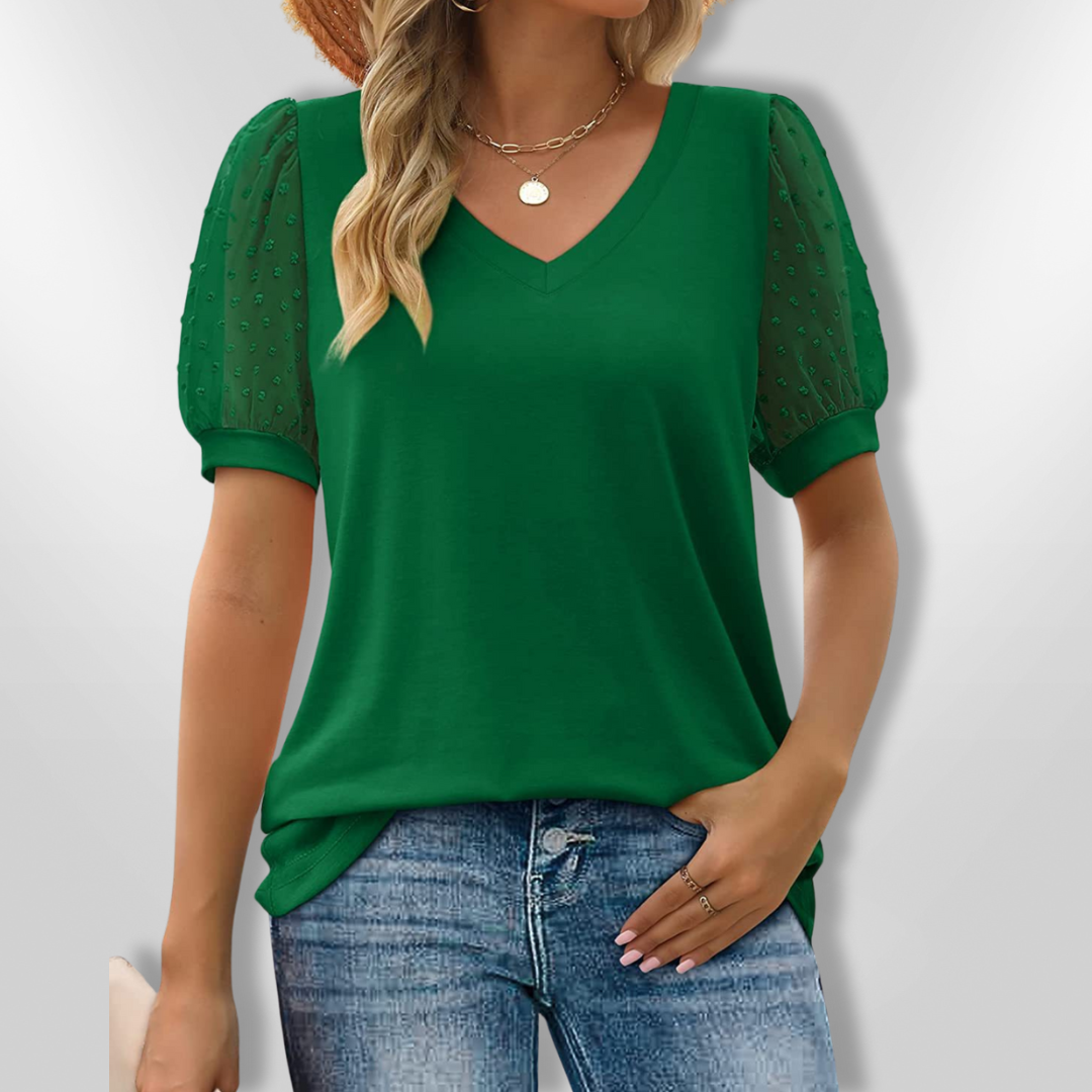 Feminin V-hals topp med elegante puffermer, ideell for våren og sommeren. En komfortabel dametopp.