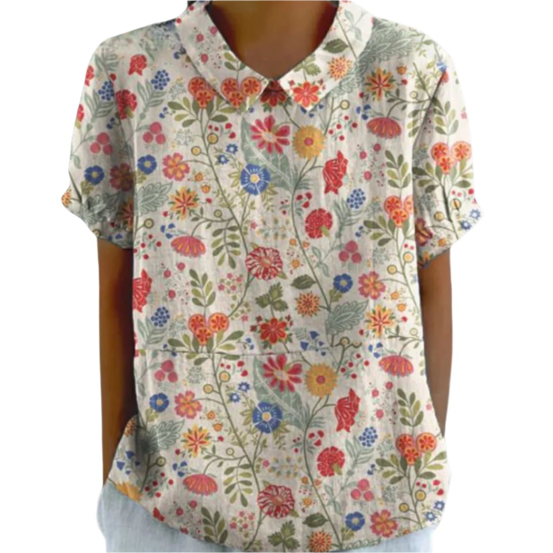 Kvinnebluse med fargerikt blomstertrykk, løs passform. Perfekt vårbluse for elegant hverdagsstil.