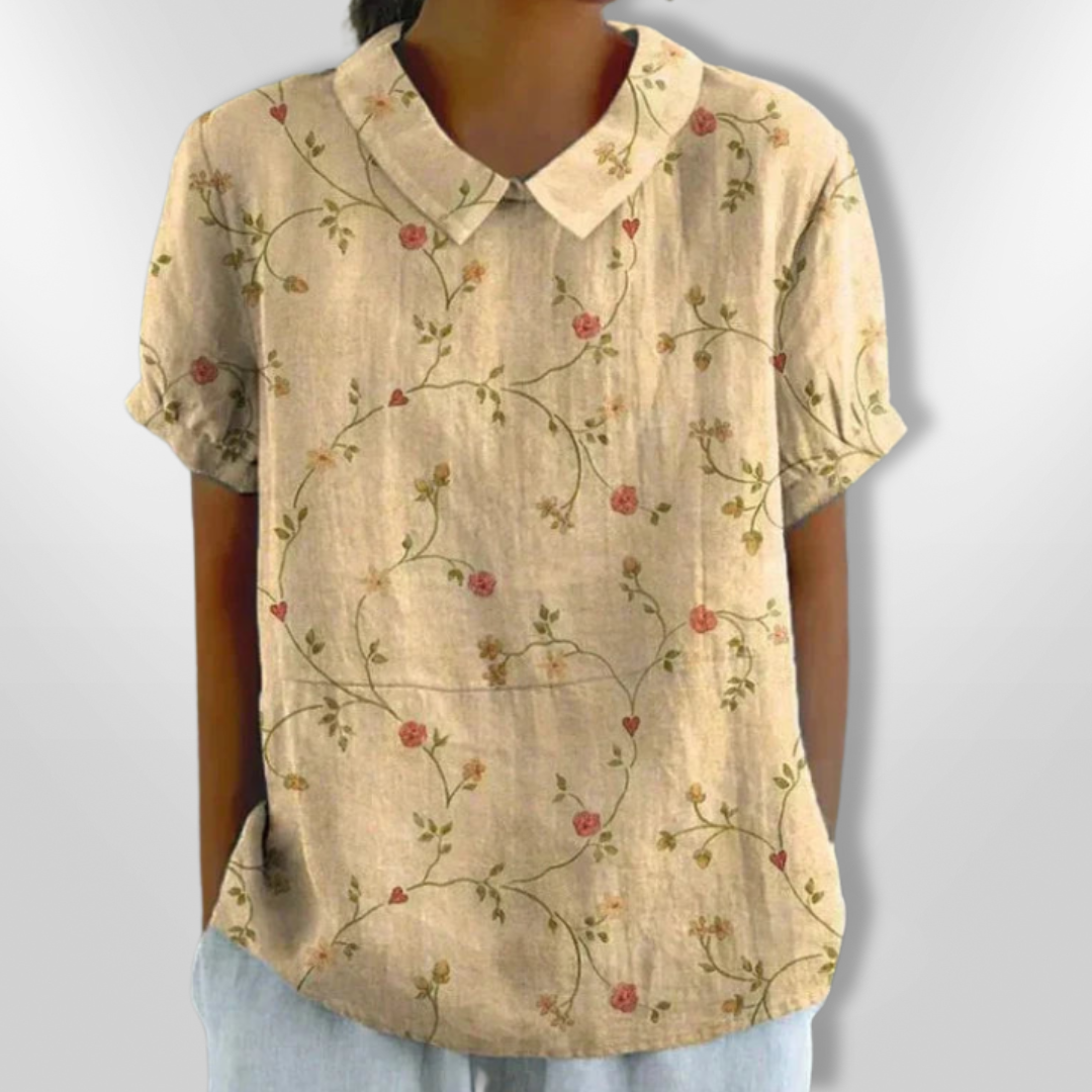 Damebluse med blomstertrykk og løs passform, stylet for en profesjonell kontorstil. Elegant og behagelig.