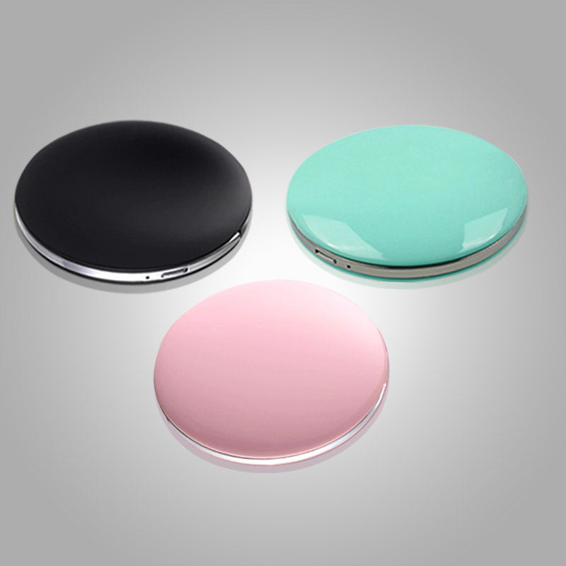 Elegant bærbart sminkespeil med integrert LED-lys, perfekt for reise og daglig bruk.