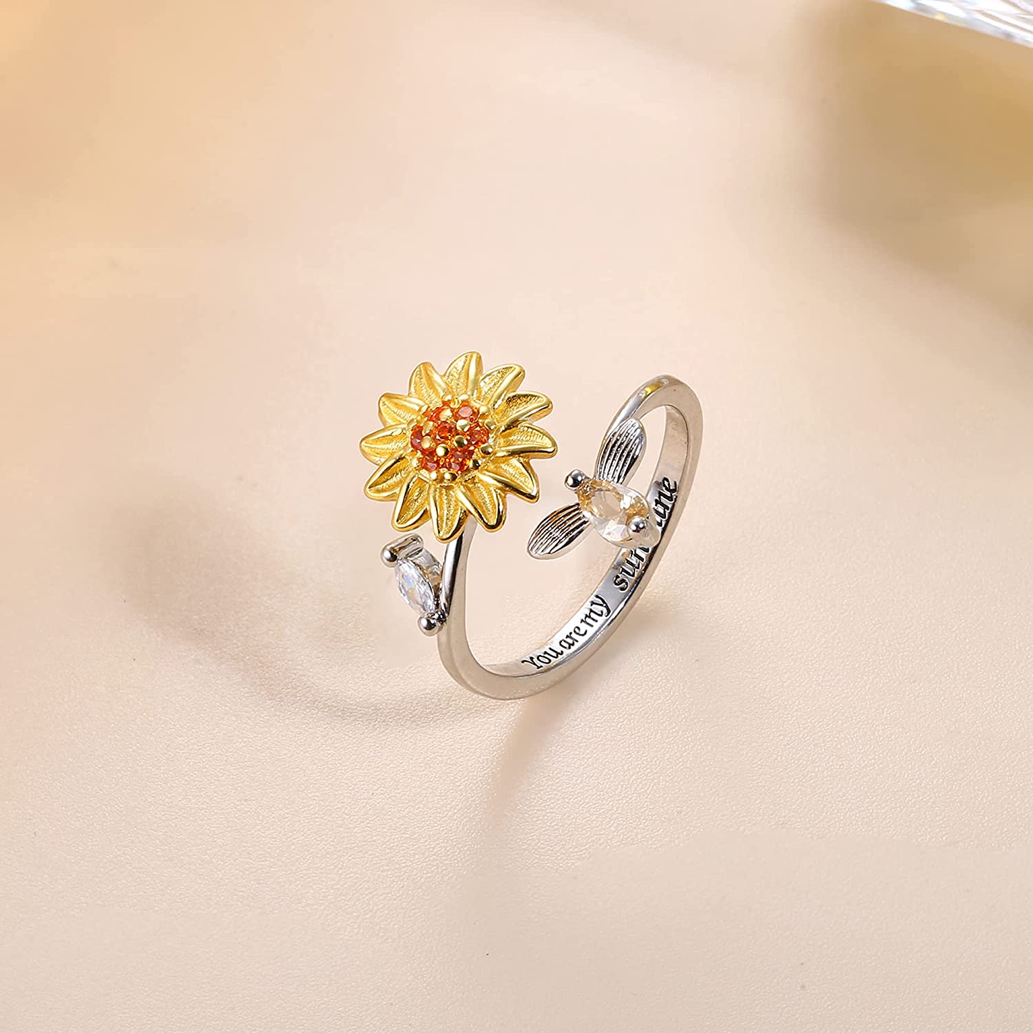 Elegant solsikke angstring for kvinner. Justerbar spinnerring i kobber for stresslindring og økt fokus.