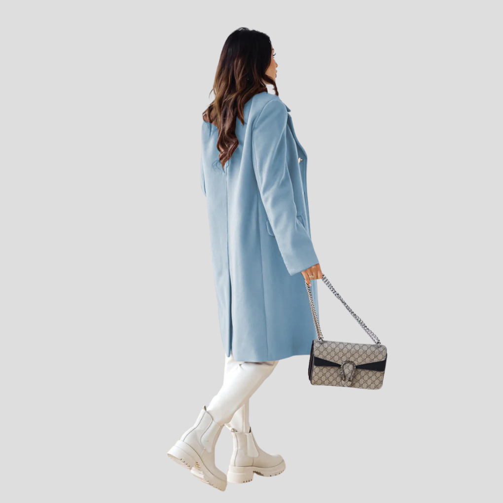 Svart dobbeltknappet damefrakk, elegant lang modell i ullblanding for formelle anledninger.