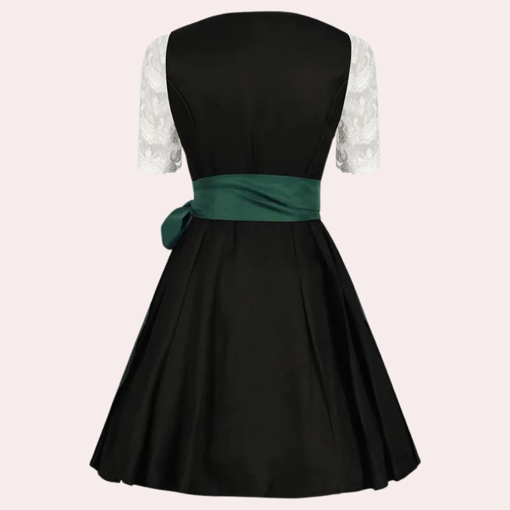Festlig Oktoberfest drakt for kvinner med klassiske elementer og elegant forkle, perfekt for temafester.