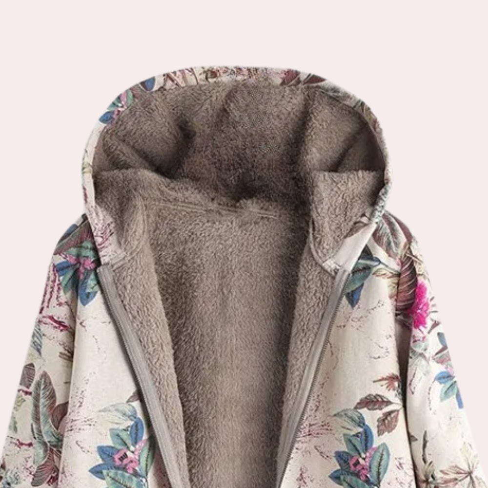 Varm og komfortabel rosa damejakke med hette, perfekt som stilfull fritidsjakke om vinteren.