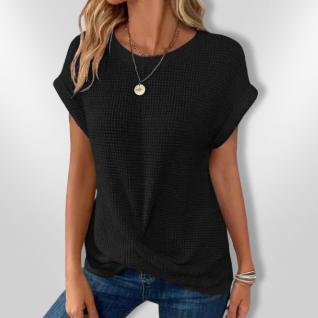 Elegant svart damebluse med løs passform og luftig stoff, en allsidig topp for hverdagsmote.