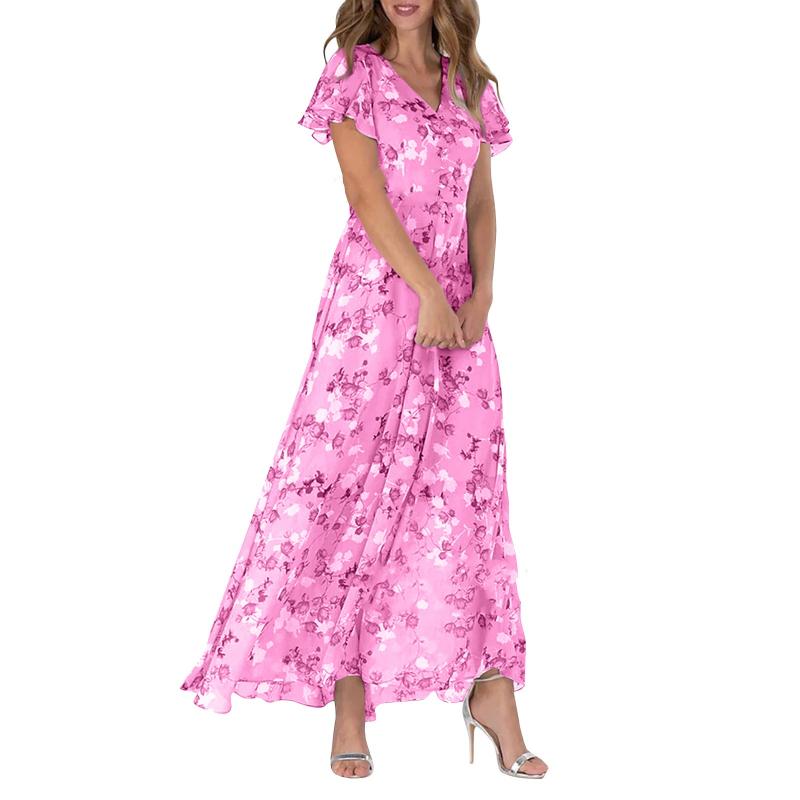 Helbilde av stilig dame maxi kjole med fargerikt blomstermotiv og feminine sommerfuglermer, en flott sommerkjole.