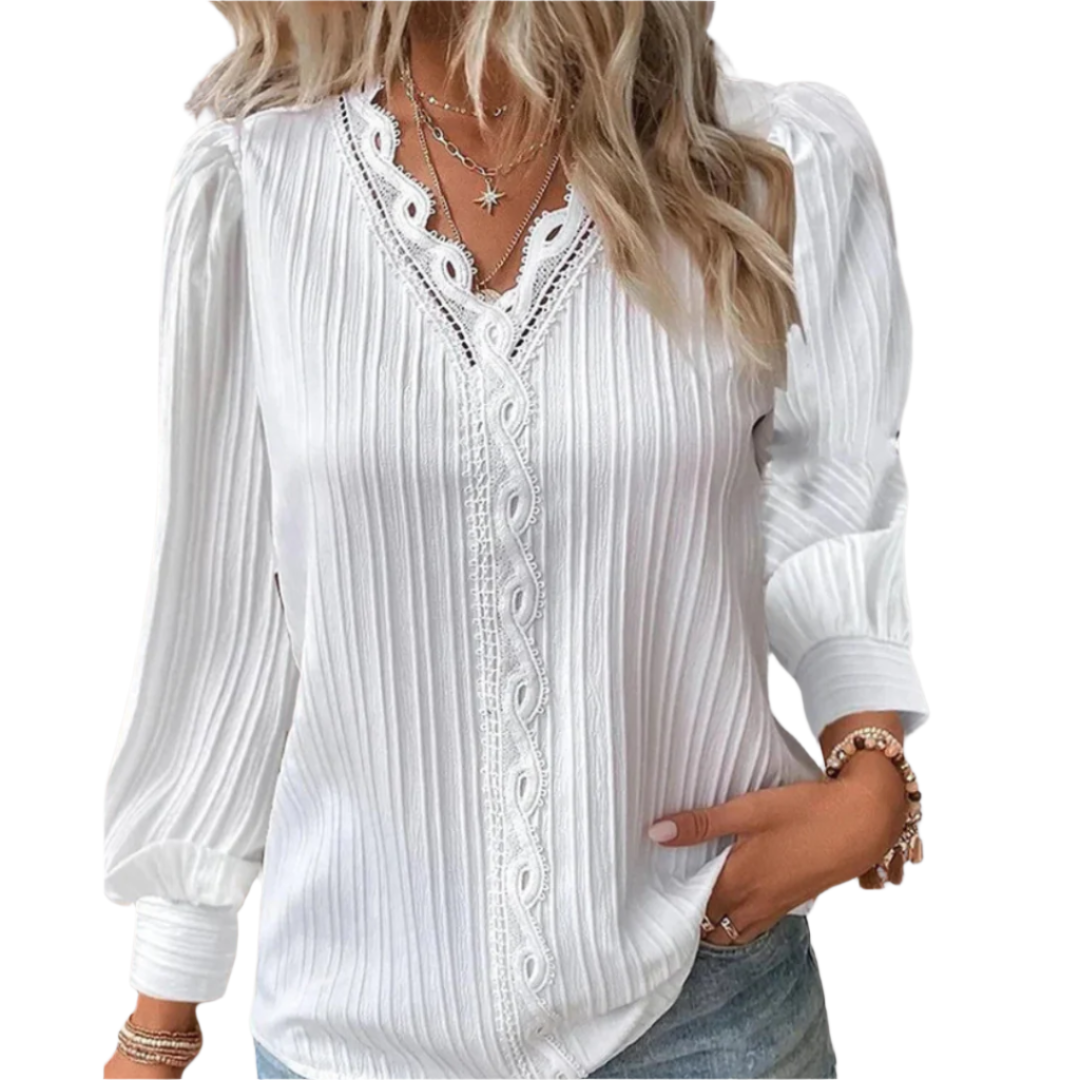 Langermet kvinnebluse med elegante detaljer, perfekt som hverdagsbluse eller festtopp.