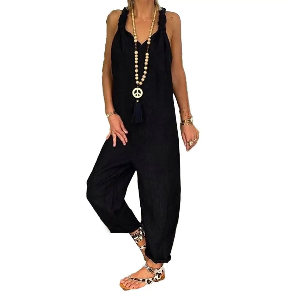 Lett ryggløs jumpsuit for kvinner med justerbare knytestropper, perfekt for sommer og ferie.