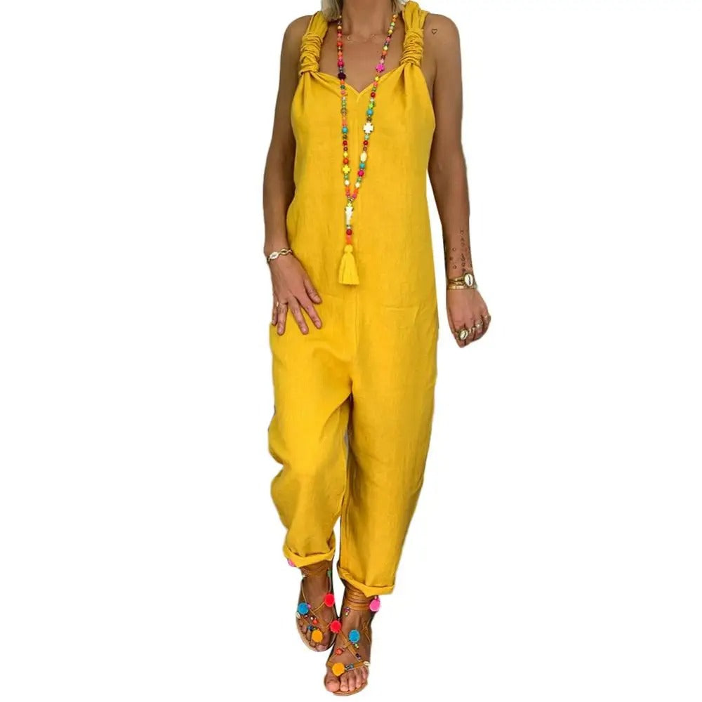 Elegant festantrekk: Komfortabel jumpsuit med dyp rygg og knytestropper. Perfekt for stilige kvelder.
