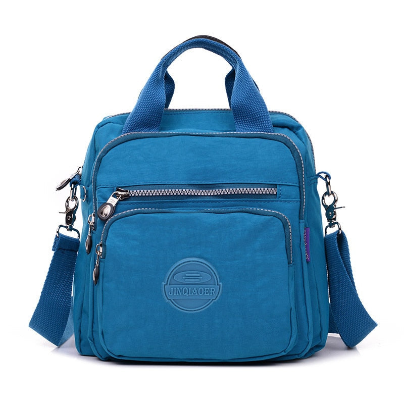 Nylon crossbody-veske for kvinner, lett og funksjonell med justerbar reim.
