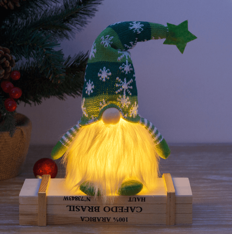 Sjarmerende lysende julepynt: Rød og grå nisse med mykt lys.