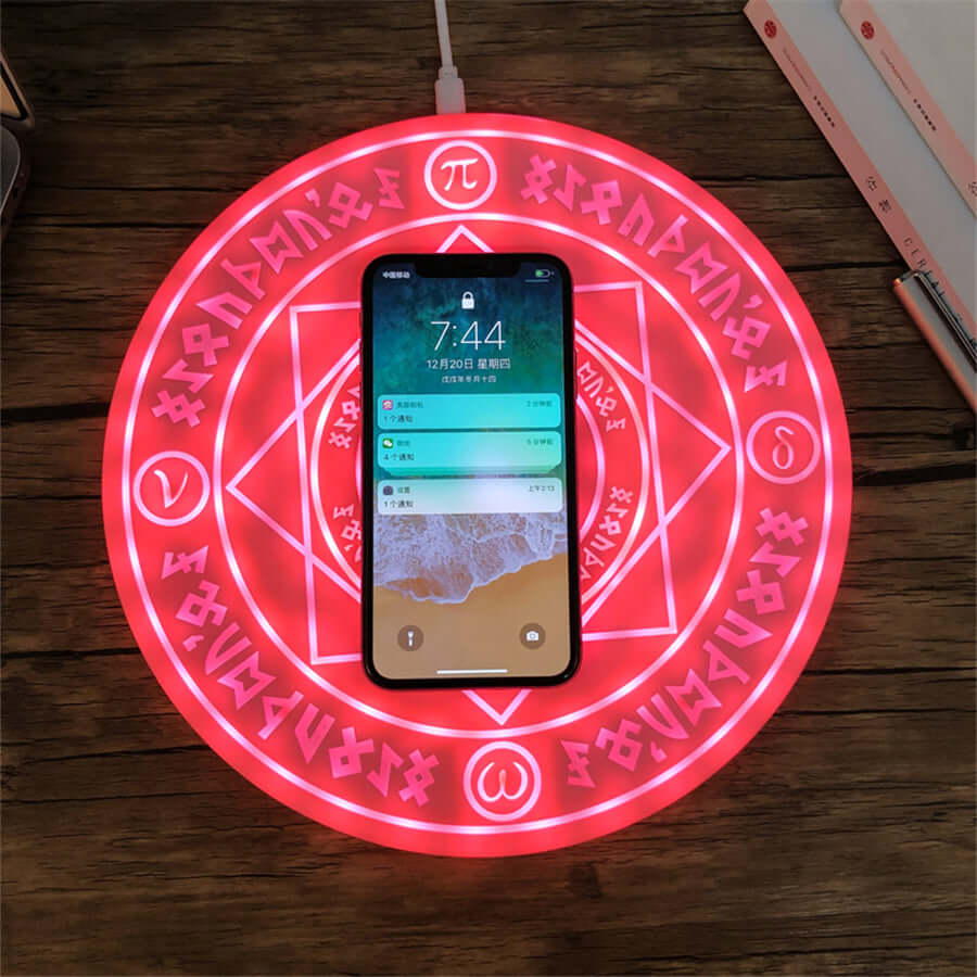 Futuristisk trådløs ladeplate med lys- og lydeffekter, kompatibel med Qi-telefoner.