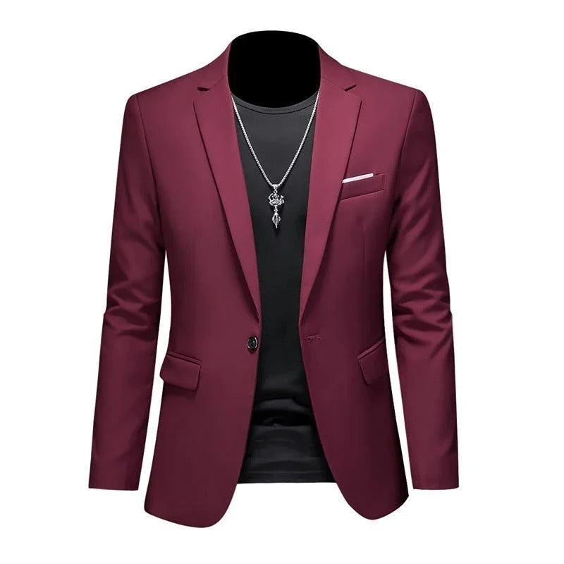 Elegant herreblazer i mørkegrønn, med moderne design, egnet for høst- og vintermote.