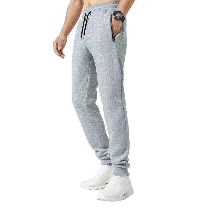 Stilige grå menns joggebukser for trening og fritid, med fokus på komfort og stil.