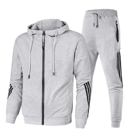 Allsidig herre treningsdrakt brukt som komfortabelt fritidsklær for menn med sporty stil.