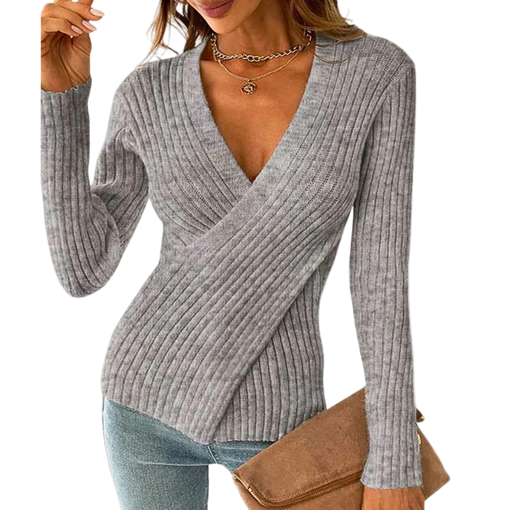 Myk dame v-hals genser med trendy kryssdetalj. Perfekt for en stilfull og komfortabel hverdagslook.