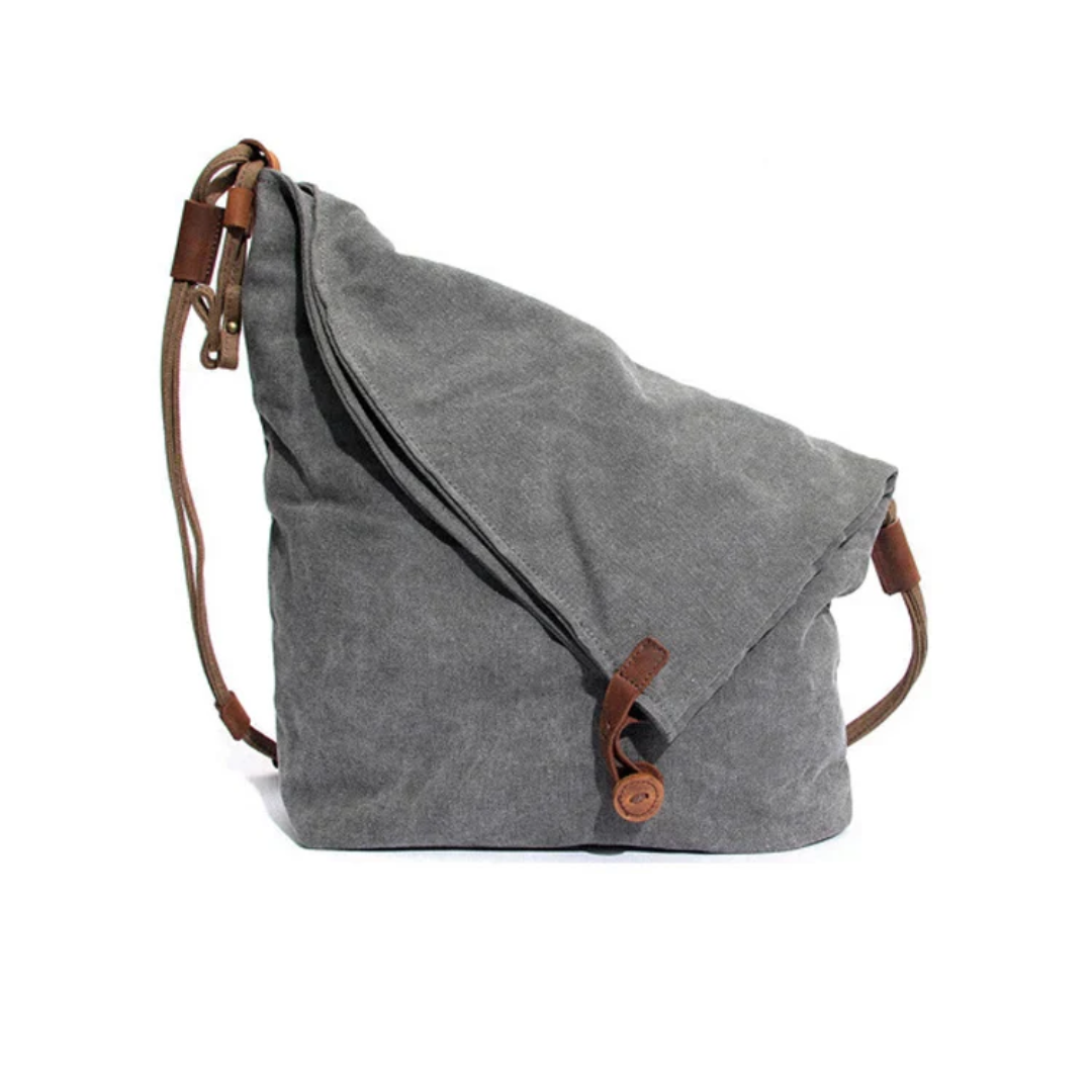 Elegant grå skulderveske for kvinner med romslig design. Trendy håndveske av høy kvalitet for damer.