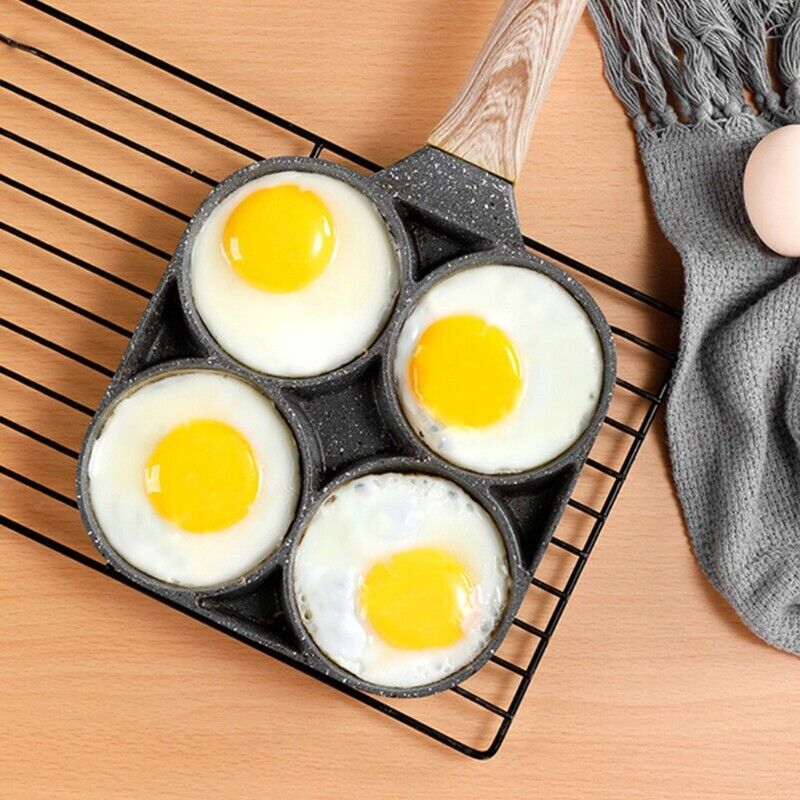 Ergonomisk nonstick stekepanne for 4 egg, med jevn varmefordeling for perfekt frokost hver gang. Grå design.