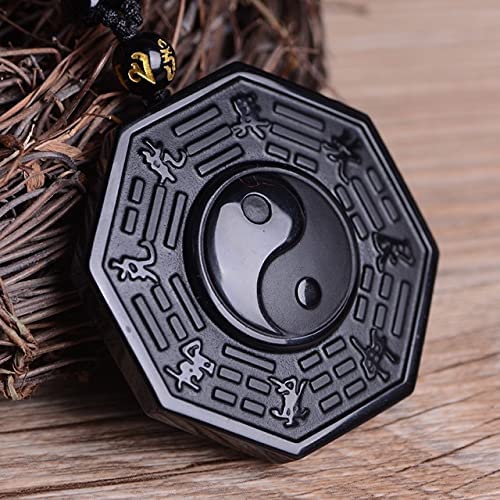 Smykke med dypt svart obsidian og Yin Yang-symbol. Perfekt for spirituell balanse.