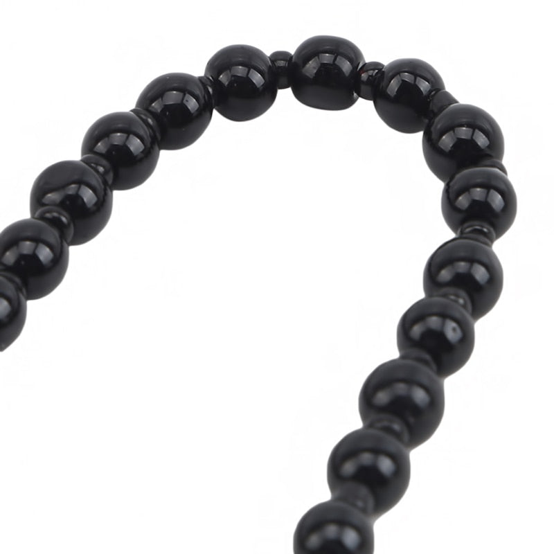 Visuelt slående obsidian Yin Yang smykke. Ideelt for de som søker beskyttelse og balanse.