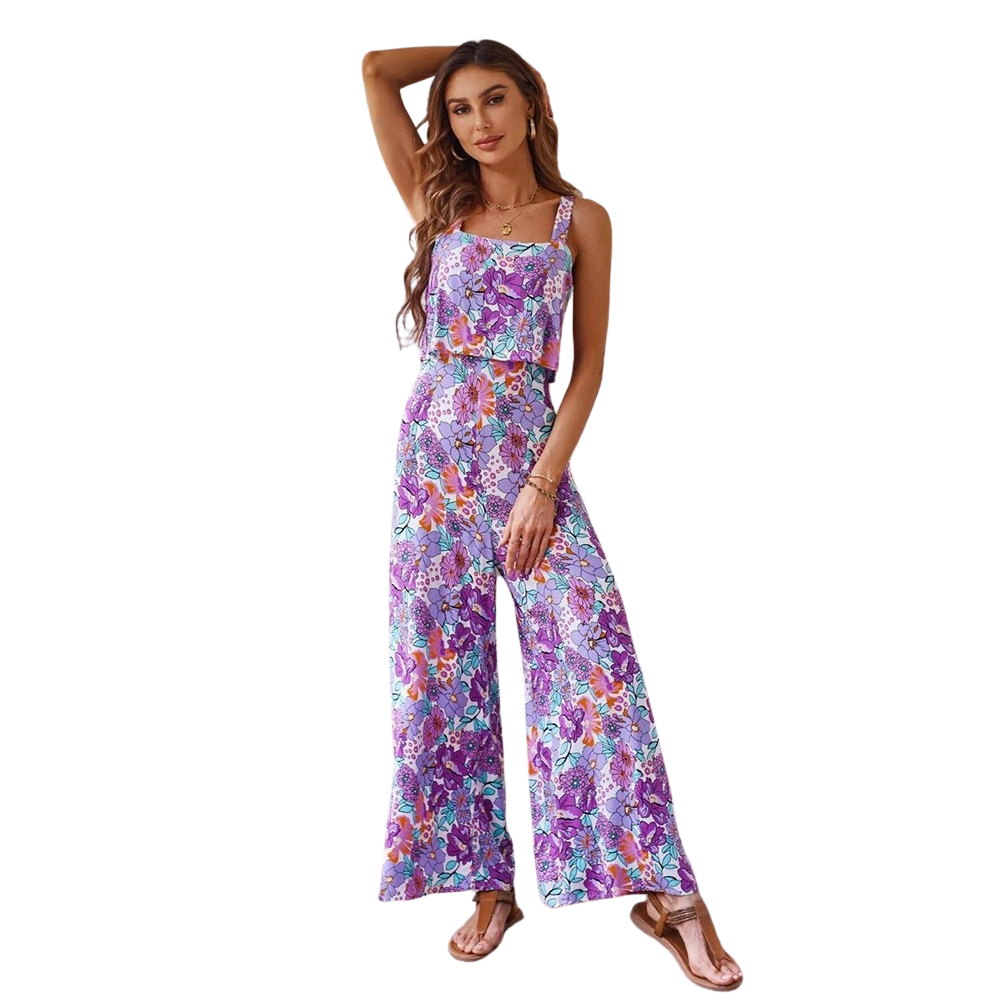 Elegant ryggløs dame jumpsuit med blomstermønster, vide ben, perfekt for sommerstil og komfort.