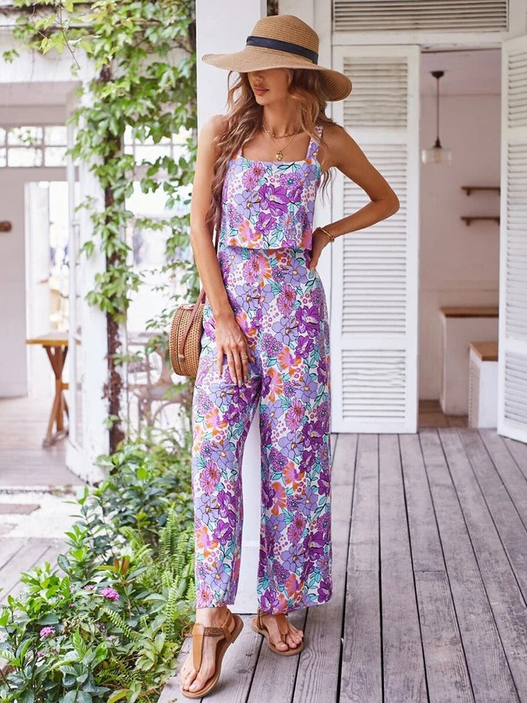 Komfortabel blomstret sommerdrakt jumpsuit for dame, ryggløs design, perfekt fritidsplagg.