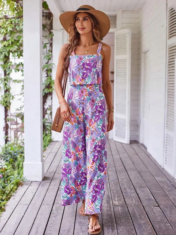 Trendy blomstret jumpsuit med vide ben og ryggløs design, elegant sommerstil for kvinner.