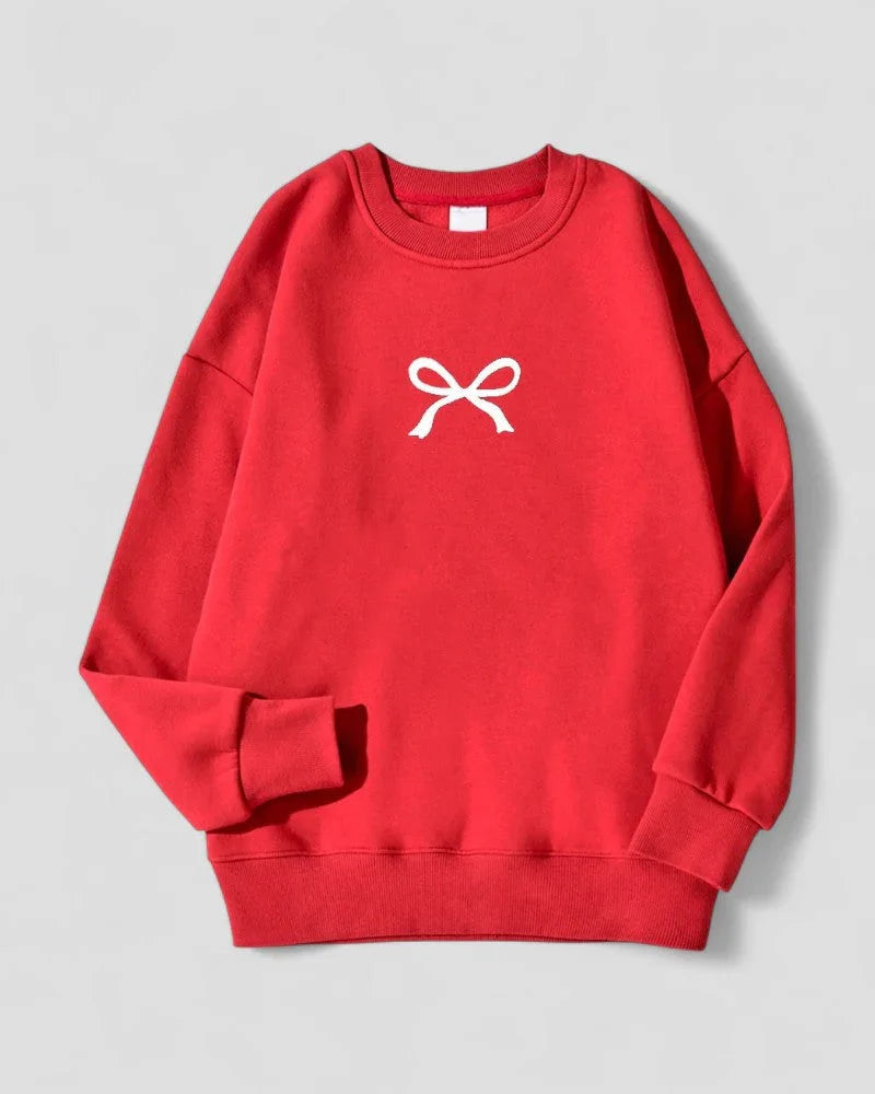 Varm oversized damegenser i koselig bomullsblanding med pen sløyfedetalj. Perfekt for kaldere dager.
