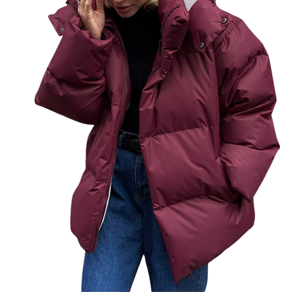 Oversized polstret kvinnejakke med quiltet hette, perfekt for høst og vinter. Komfortabel og varm yttertøy.
