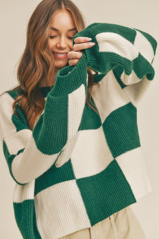 Trendy oversized damegenser med stilig rutemønster, ideell for en uformell, moteriktig look.