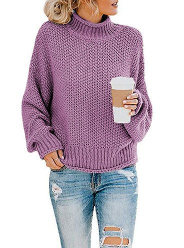 Varm damegenser i oversized strikk med høy hals. Ideell for kaldere dager, gir komfort og stil.