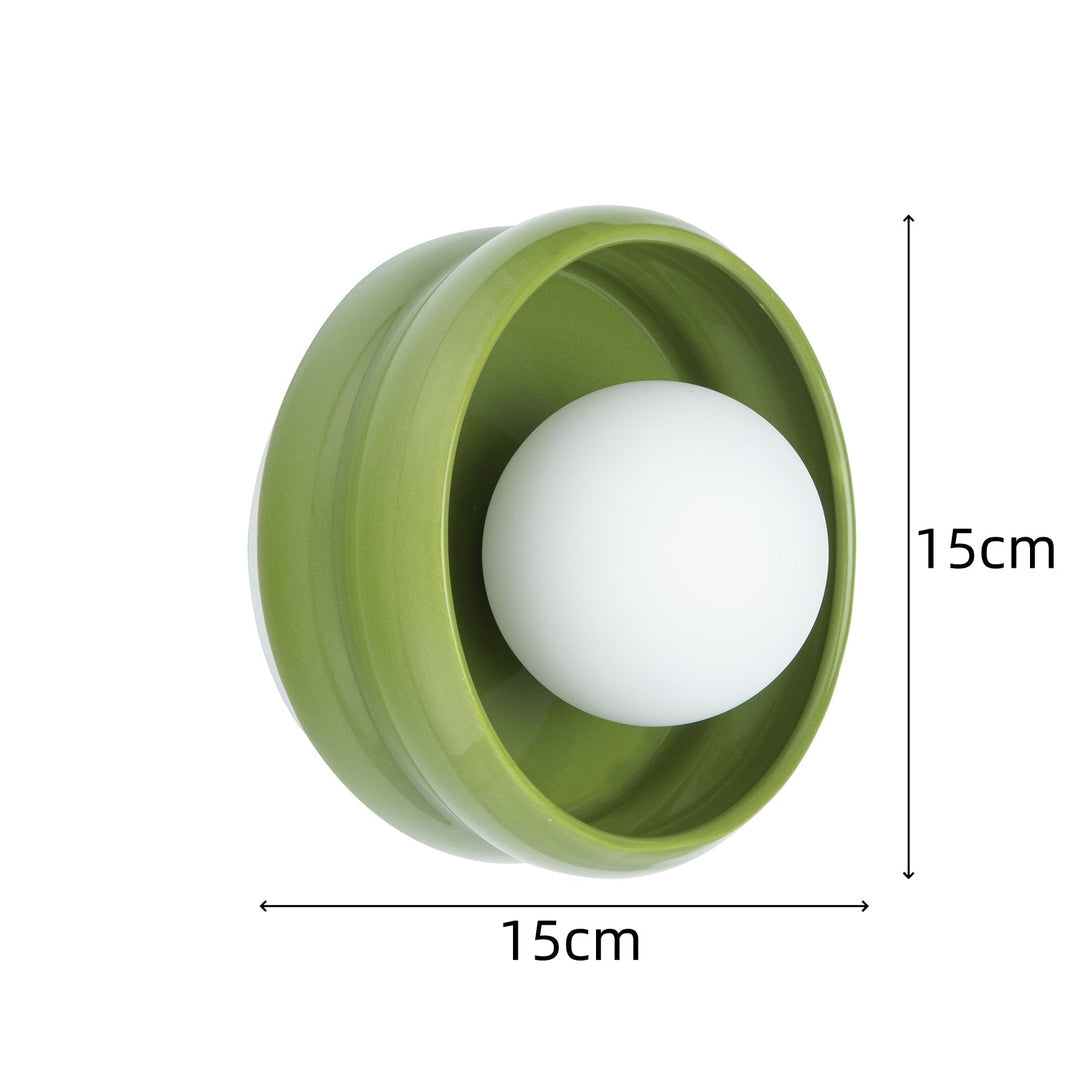Stilfull gul rund vegglampe Circo, moderne atmosfærisk belysning for innendørs bruk, perfekt for en koselig atmosfære.