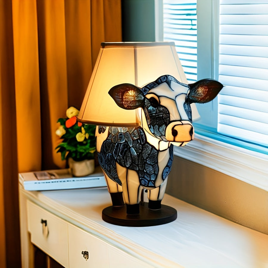 Dekorativ bordlampe med søt ku-design, perfekt som stemningslys i stue eller barnerom. Unik gave.