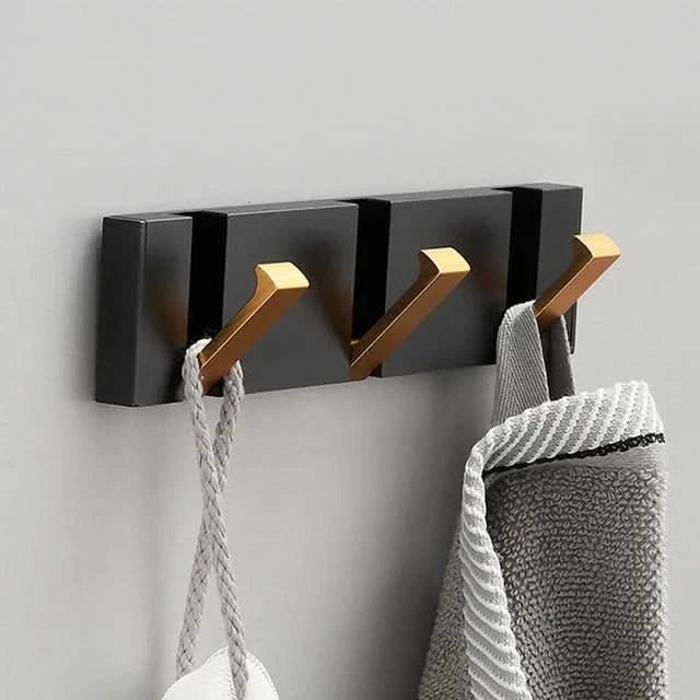 Stilren, moderne veggkrok med sammenleggbar funksjon, perfekt for minimalistisk interiør i hjemmet.