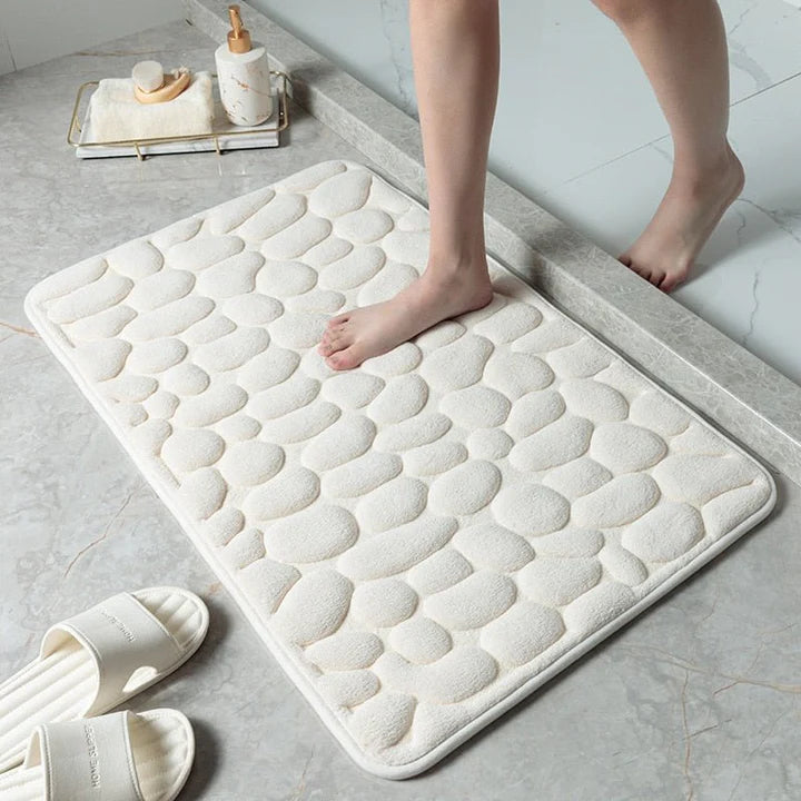 Brosteinsdesign badematte for baderommet, tilbyr sklisikker komfort og spa-følelse. Hygienisk kvalitet.