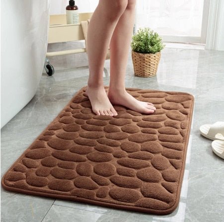 Hygienisk badematte med sklisikker funksjon og brosteinsdesign. Gir komfort og spa-følelse i baderommet.