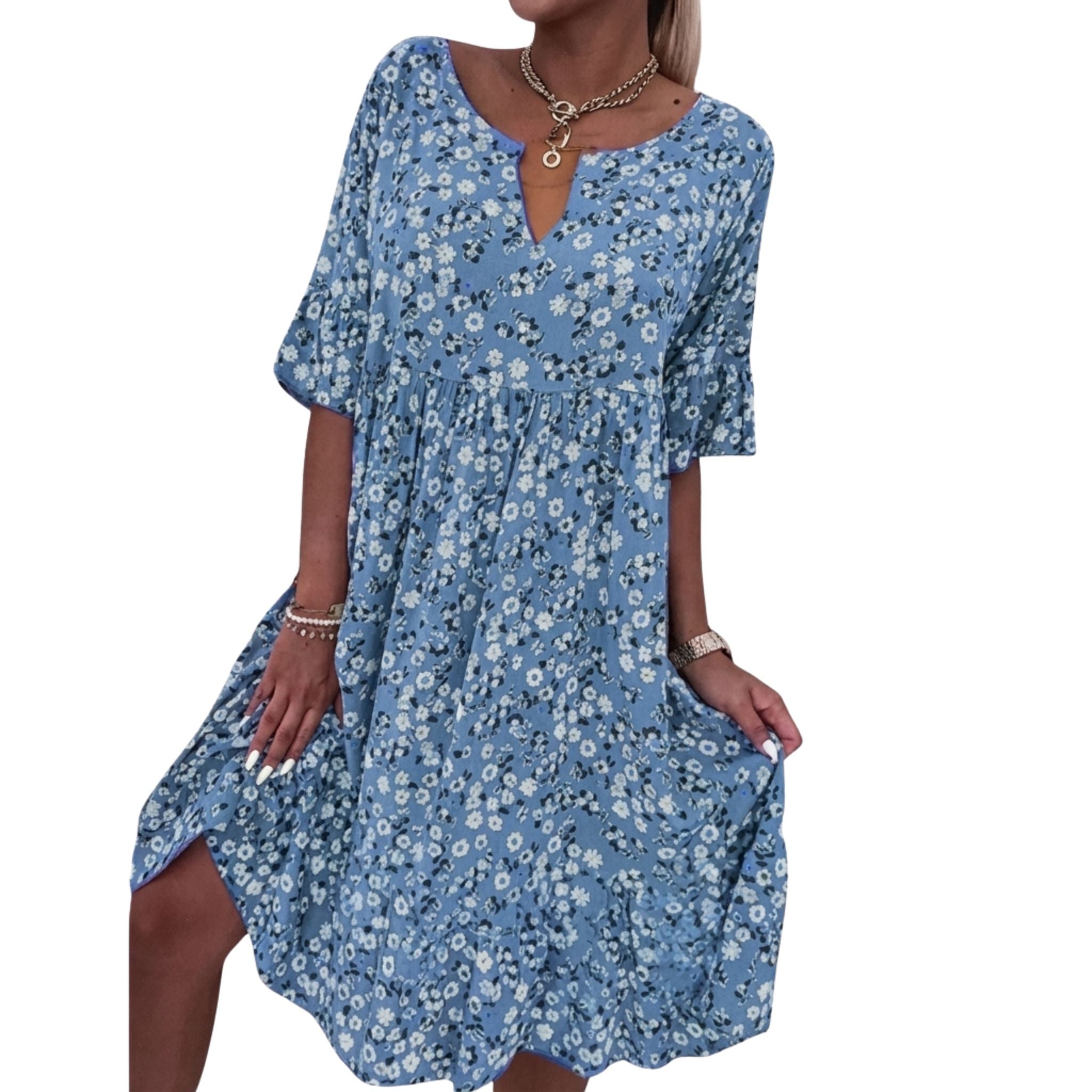 Elegant blomstret sommerkjole for kvinner. Løs passform og lett stoff sikrer komfort og stil i sommervarmen.