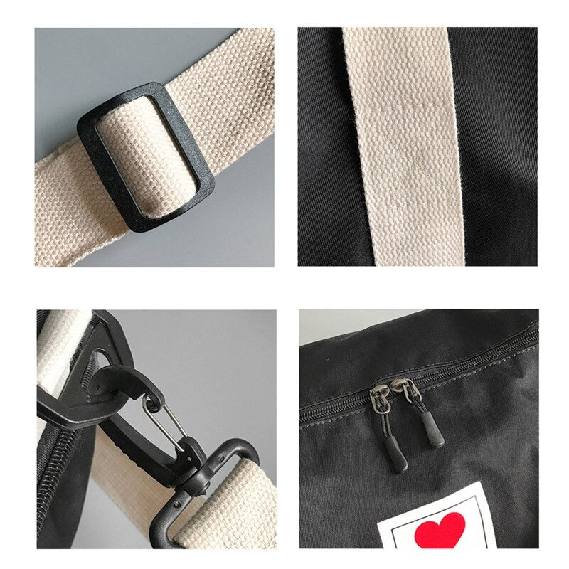 Tom sort dame duffelbag i nylon, klar for pakking til reise, trening eller weekendtur.