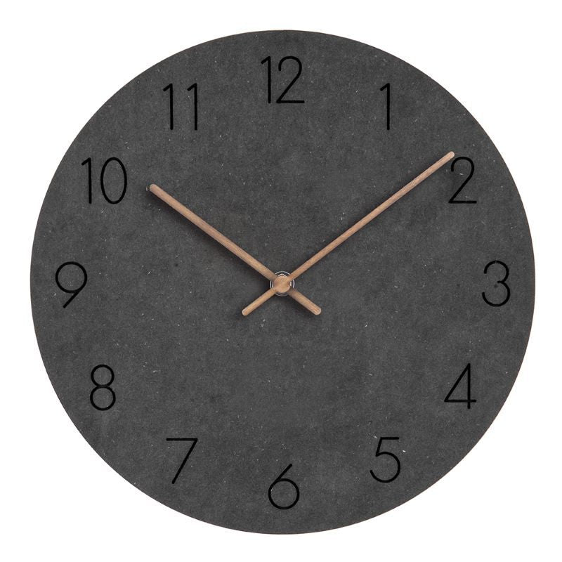 Minimalistisk og dekorativ veggklokke. Stilrent design gir ro og eleganse til moderne interiør.