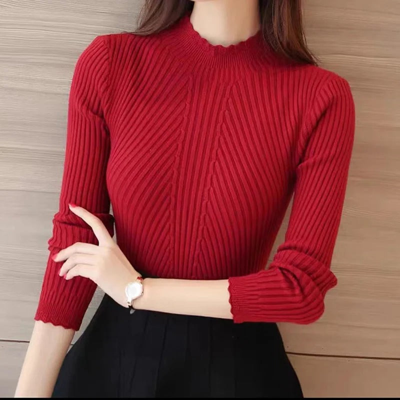 Nydelig strikket genser til dame med trendy rysjehals. Perfekt for casual mote.