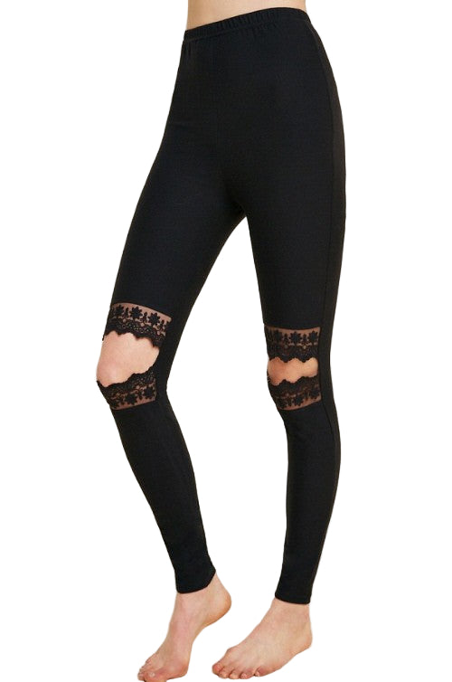 Svart dameleggings med elegante blondeutskjæringer, perfekt for motebevisste kvinner. Trendy og komfortabel slimfit.