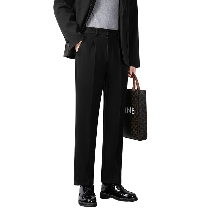 Svarte slim fit minimalistiske herrebukser, elegante og moderne for kontorstil eller formelle anledninger, tidløs passform.