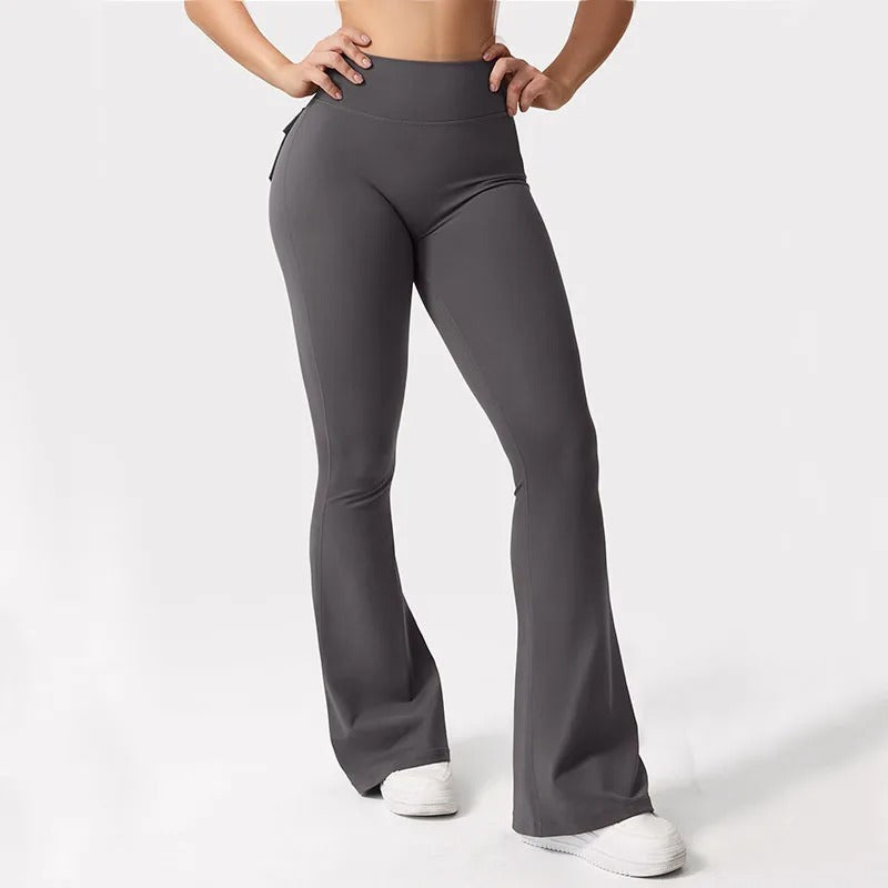 Ergonomiske yogaleggings for kvinner i svart, med høy midje, elastisk stoff og lommer for maksimal komfort.