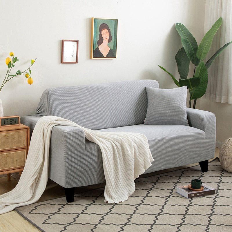 Et teksturert stretch møbeltrekk som gir din sofa et friskt og moderne utseende.