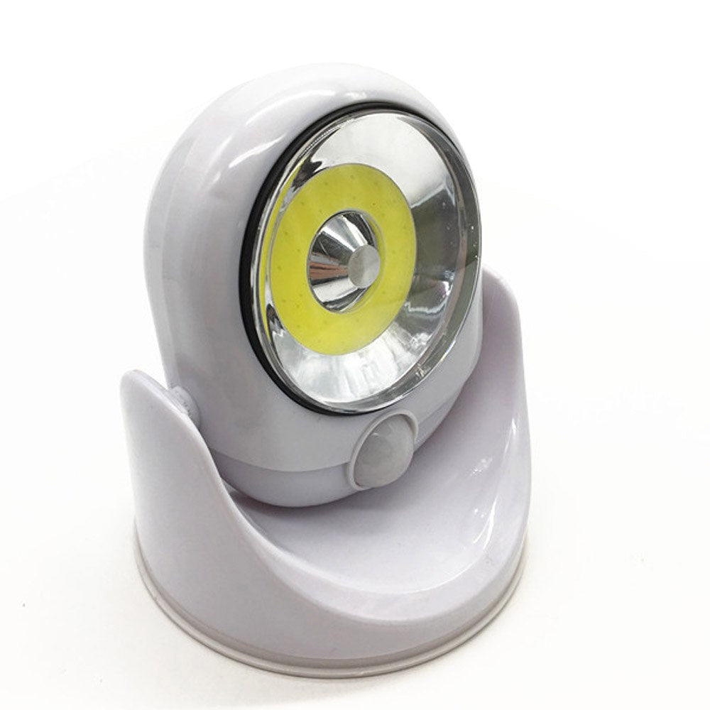 Trådløs LED-lampe med bevegelsessensor, ideell for innendørs og utendørs belysning.