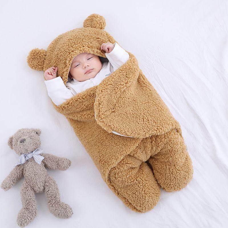 Komfortabel babyteppe-sovepose, ideell for kalde netter.